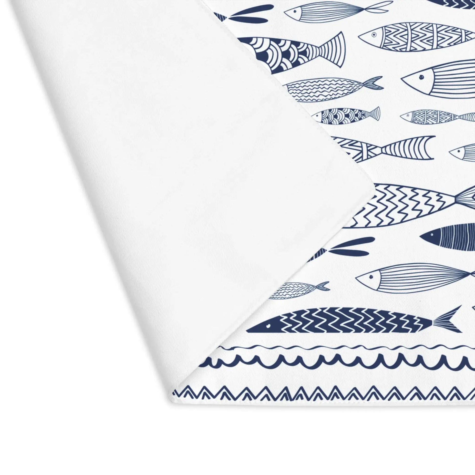 Blue Fish Cotton Placemats featuring a playful navy blue fish design on a white background.