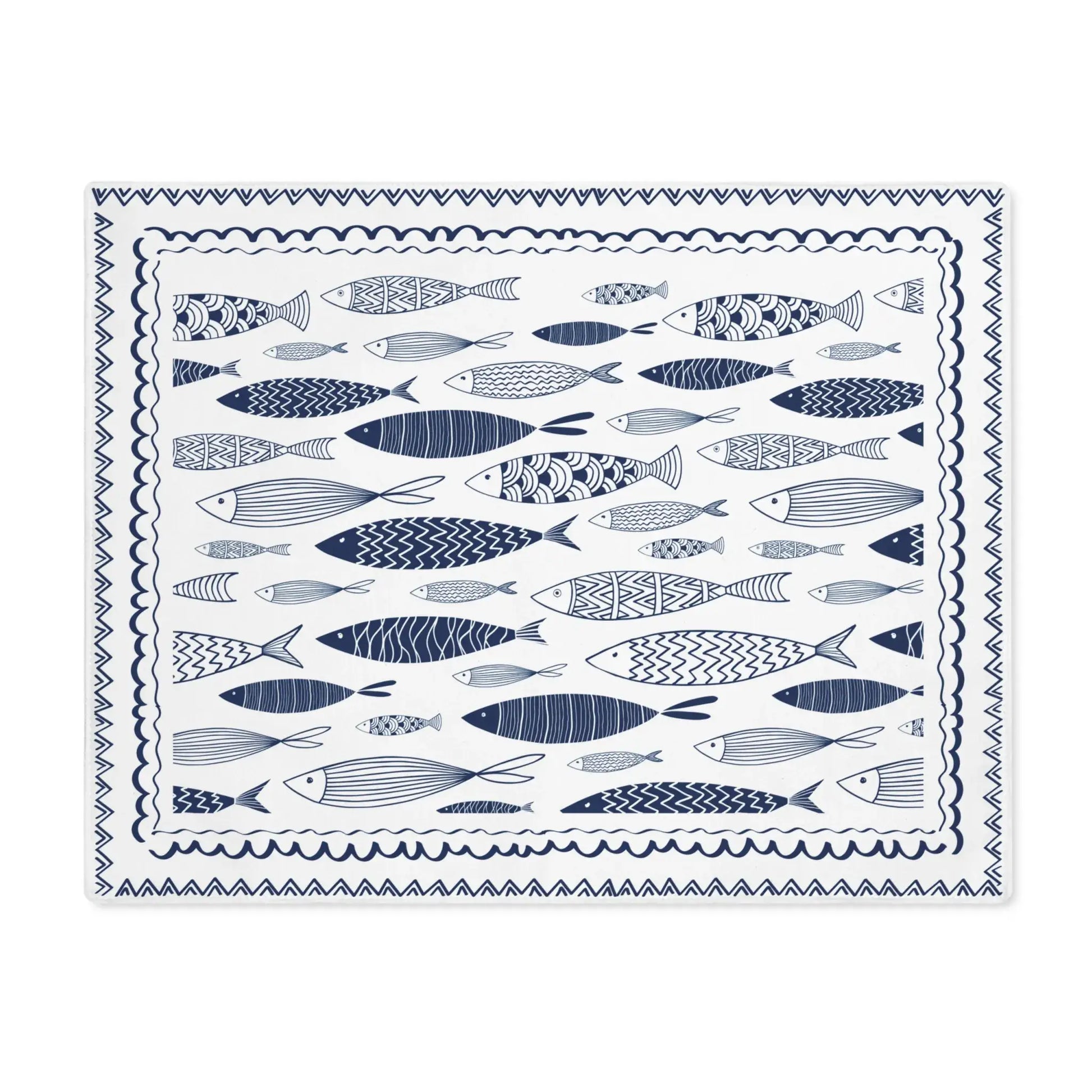 Blue Fish Cotton Placemats featuring hand-drawn fish illustrations in navy blue on a light background.