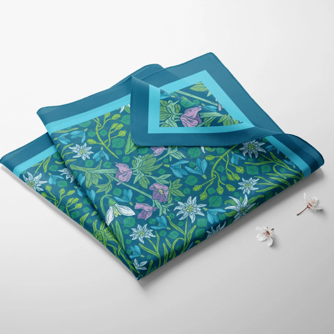 blue green scarf on white surface 