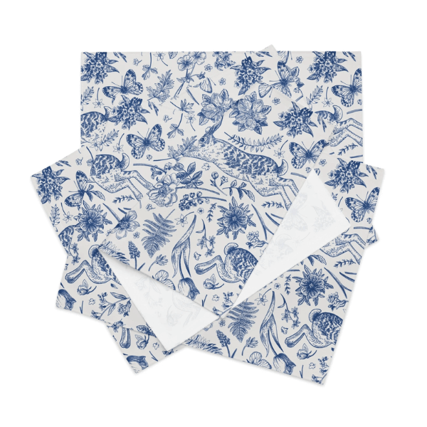 Blue Toile Bunny Placemats featuring woodland rabbits and floral designs in blue and white, perfect for Easter decor.