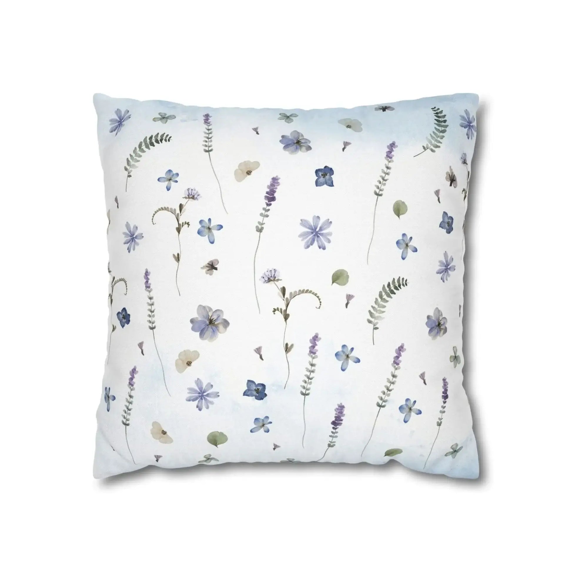 Pillow with blue butterfly and botanical pattern.