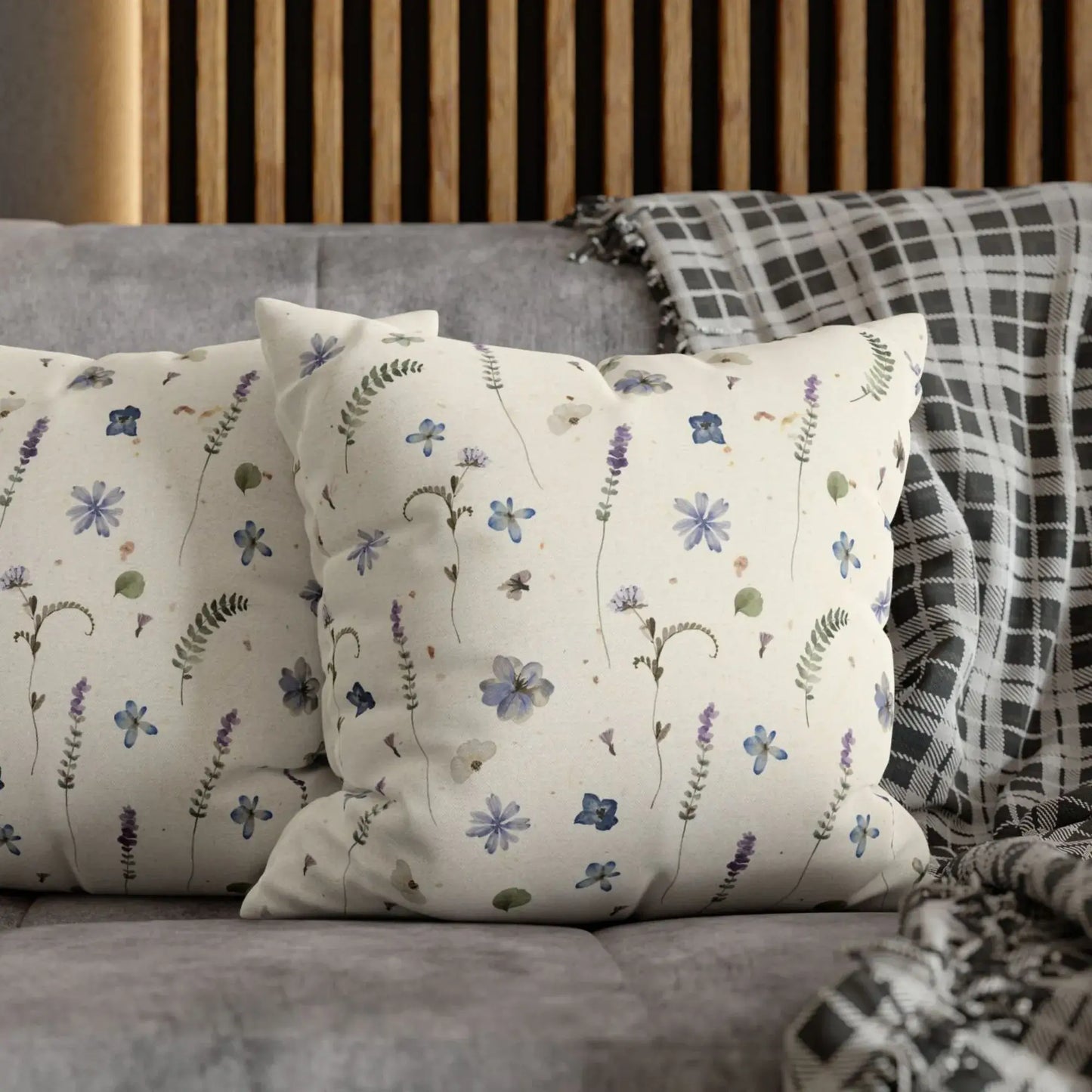 Pair of nature-inspired pillows on a modern sofa.