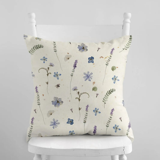 Botanical pattern pillow displayed on a chair, nature-inspired decor.