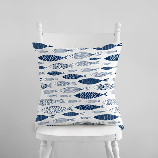 Blue fish throw pillow from Blue Water Songs on white chair