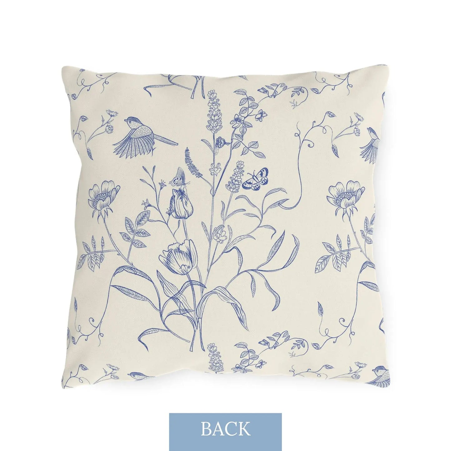 Back view of vintage-style outdoor pillow with blue botanical and bird illustrations on cream background — nature-inspired UV-resistant decor