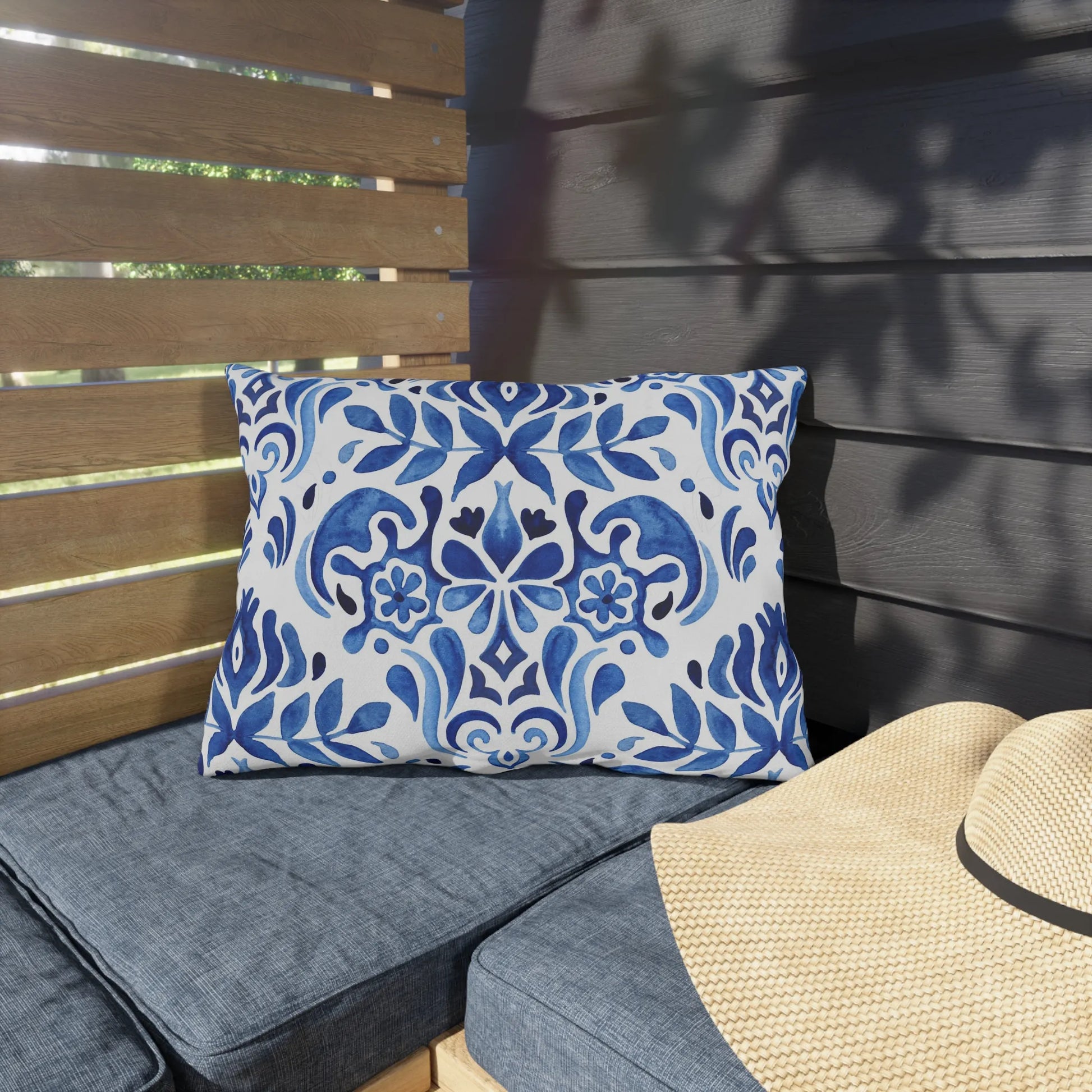 Blue Watercolor Hand-Painted Tile Pattern| OUT lumbar DOOR PILLOW from Blue Water Songs sitting on blue outdoor bench