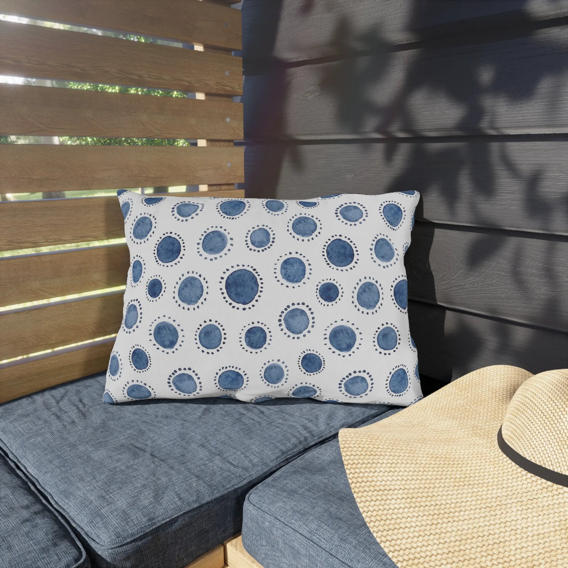 outdoor bench cushion from Blue Water Songs sitting in garden porch