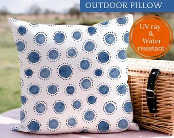 outdoor bench cushion from Blue Water Songs sitting on picnic blanket