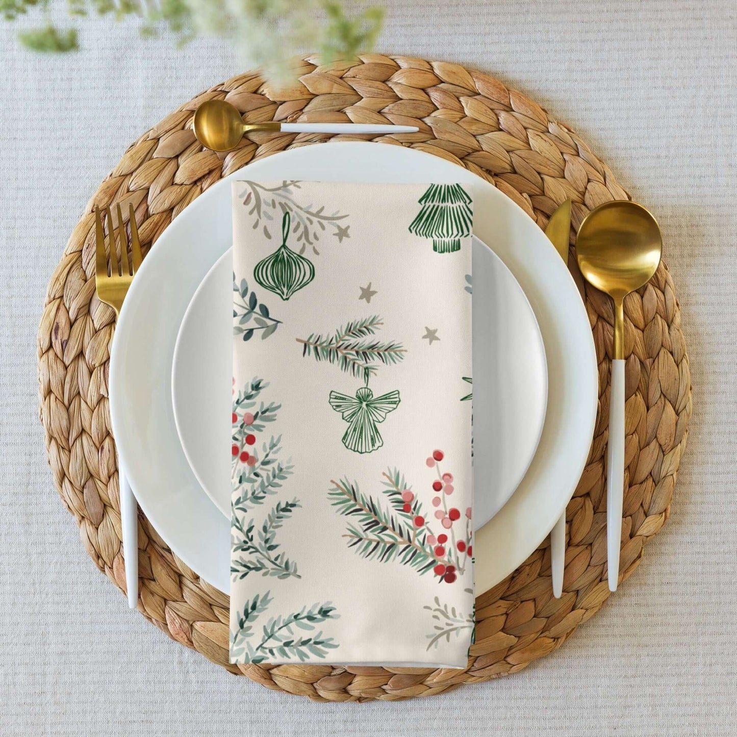 Botanical Christmas Cloth Napkins featuring festive designs with pine, berries, and holiday ornaments on a table setting.