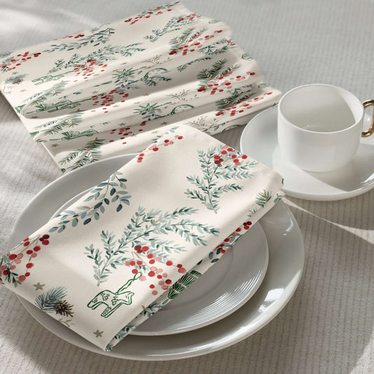 Botanical Christmas Cloth Napkins with pine branches and red berries on a cozy table setting.