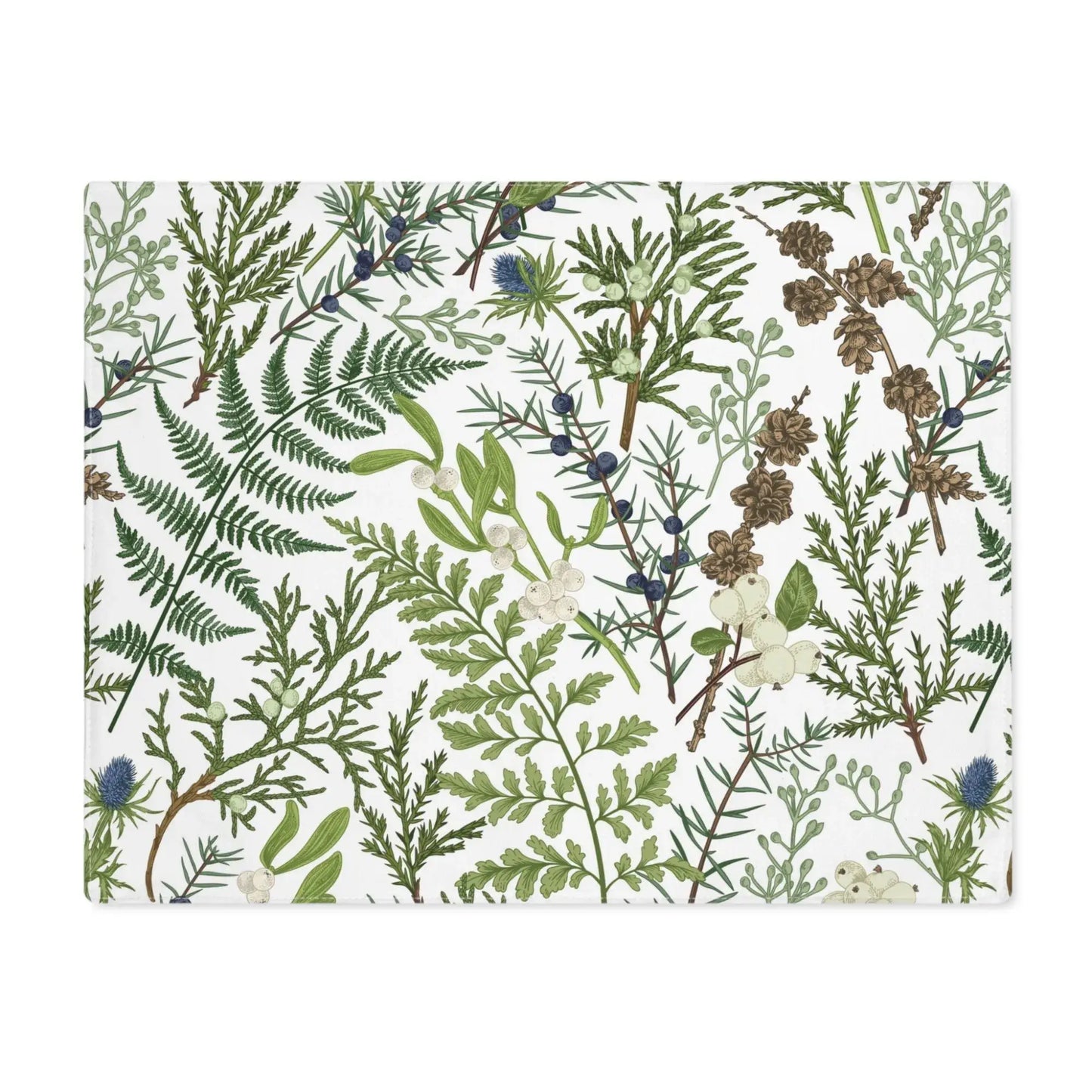 Botanical Christmas placemats featuring soft winter greenery and delicate seasonal florals for holiday table decor.