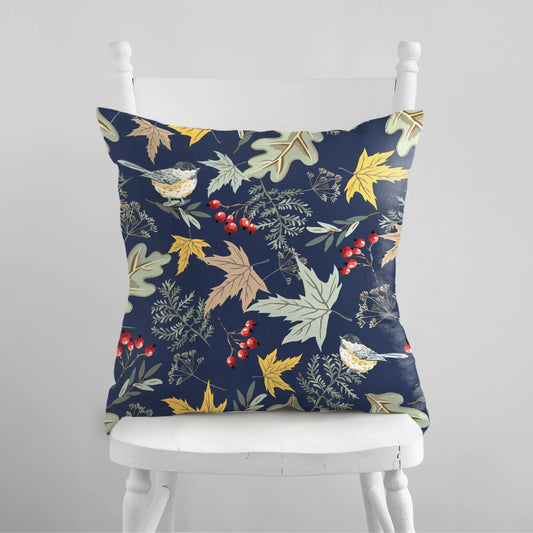 Botanical fall pillow featuring birds and autumn florals on a deep blue background, enhancing cozy interiors.