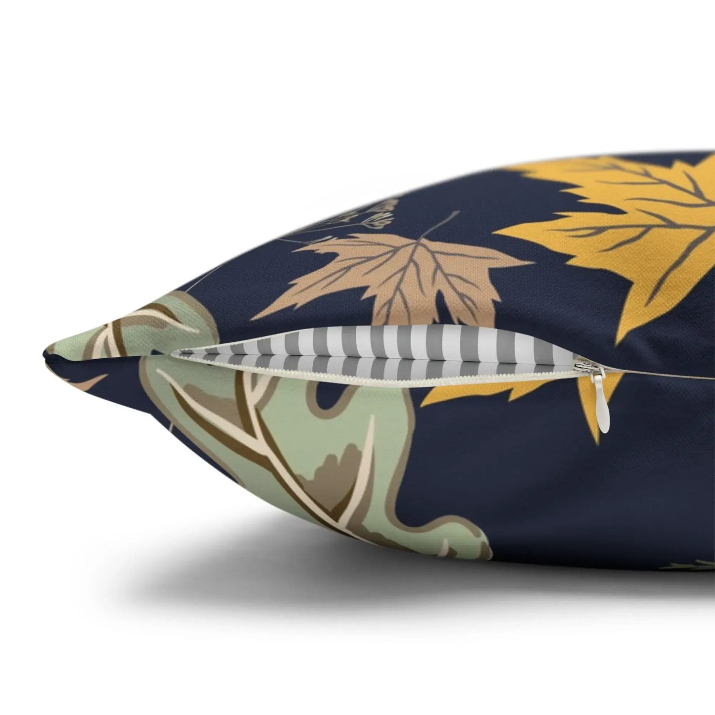 Botanical fall pillow showcasing autumn leaves with a zipper detail in a deep blue cover, perfect for cozy fall decor.
