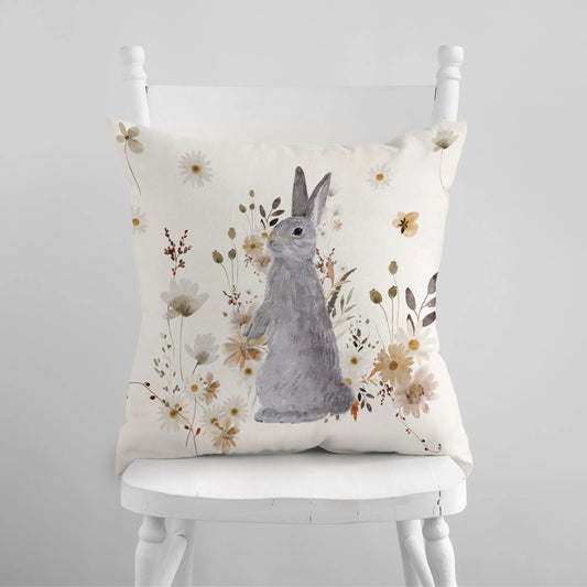 white chair with Watercolor Bunny and Fall Wildflowers PILLOW on it