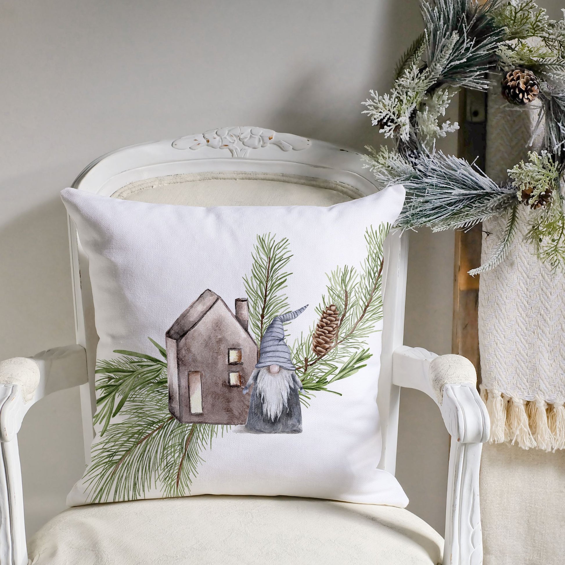 Christmas pillow with gnome and rustic house surrounded by pine branches – holiday decor