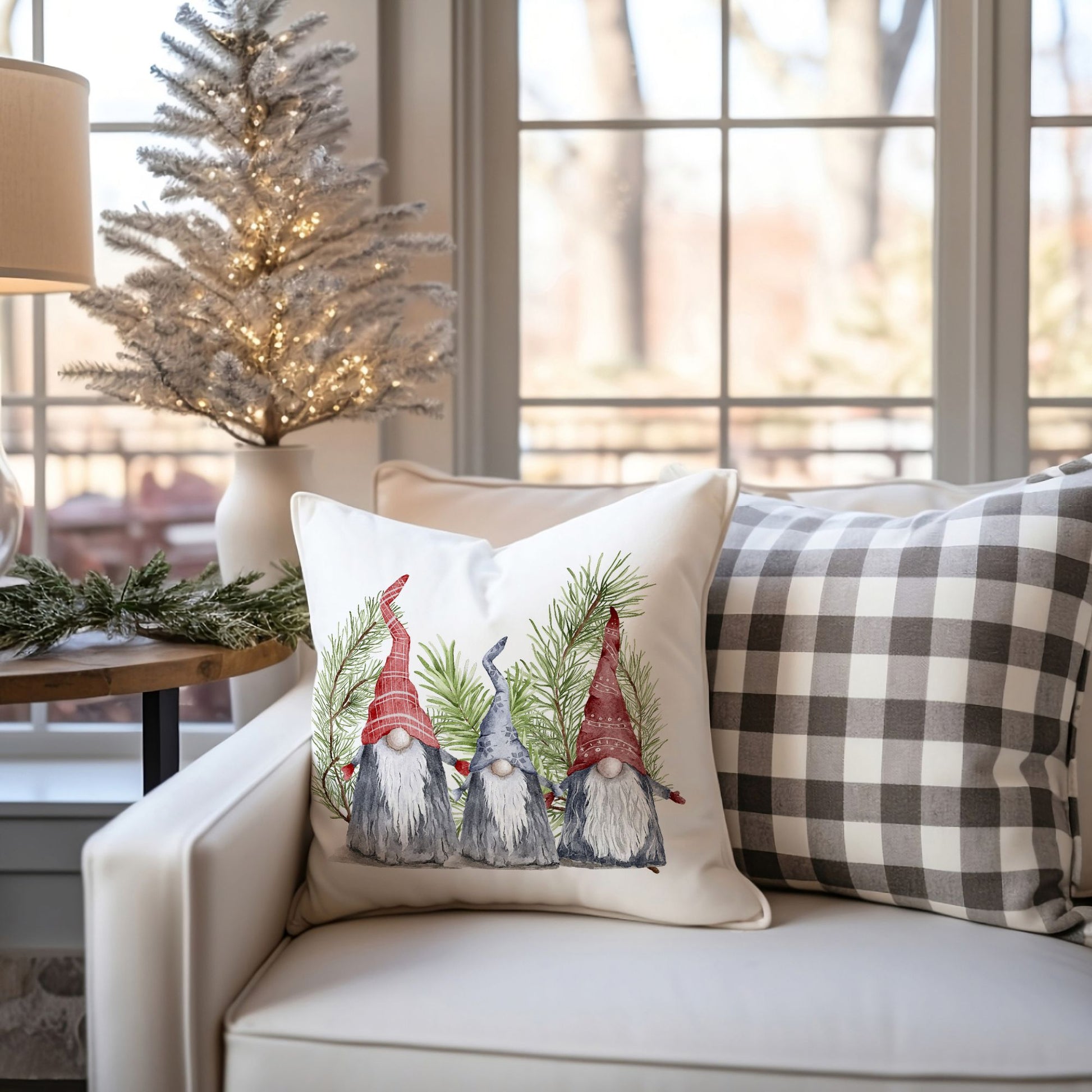 Christmas gnome pillow with pine branches on white sofa – cozy holiday decor