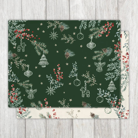 Botanical Christmas Placemat with green pine and red berry pattern on white wooden table.