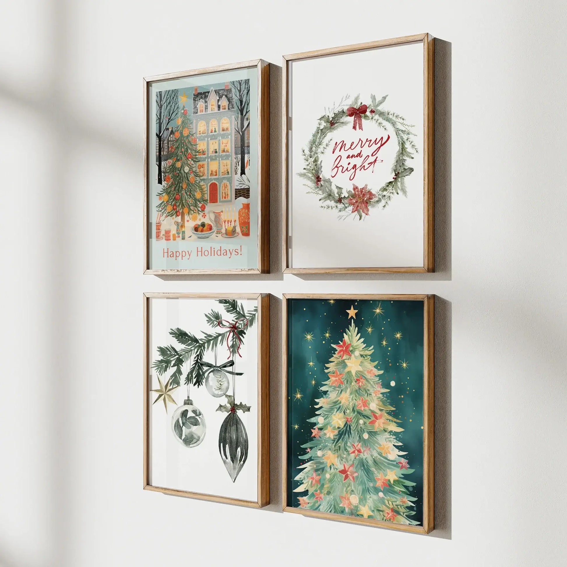 Christmas Prints Set of 4 displayed in elegant frames on a wall, featuring festive holiday designs.