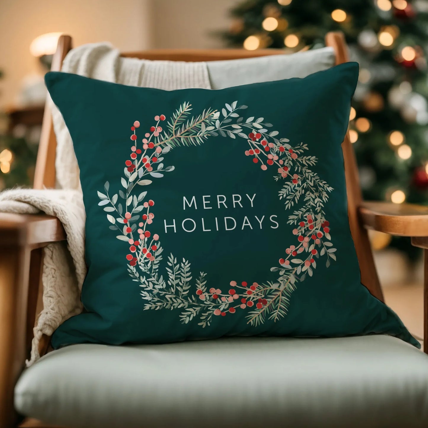 wood chair with light green cushions and Merry Holiday Christmas Wreath PILLOW from Blue Water Songs on it