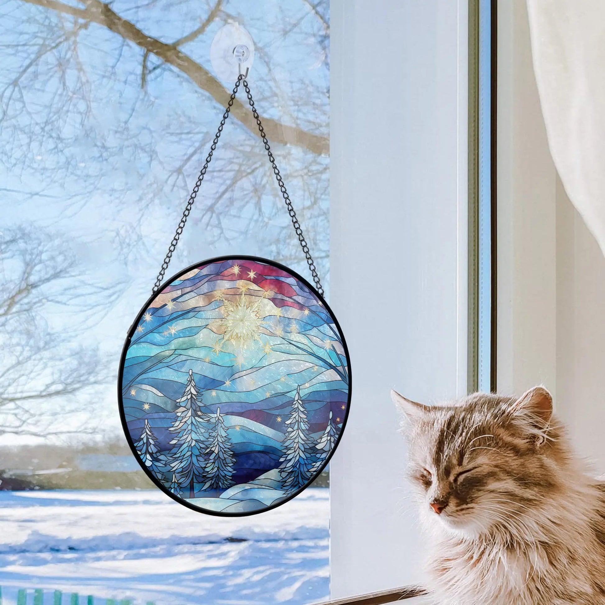 lovely cat next to window with Blue Christmas Tree Round Stained Glass Ornament from Blue Water Songs on it