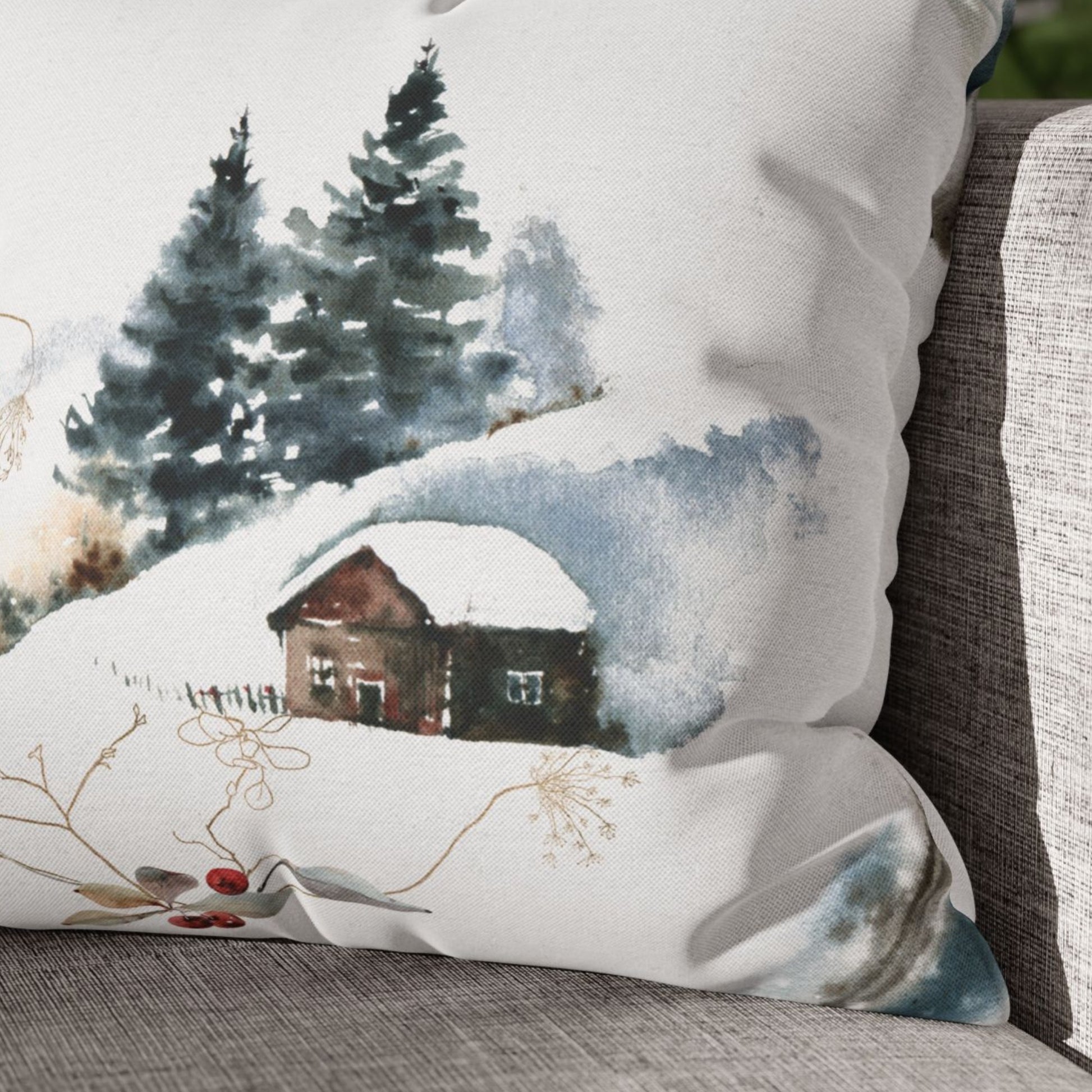 Close-up of snowy cabin on winter watercolor pillow – soft fabric texture with pine tree background