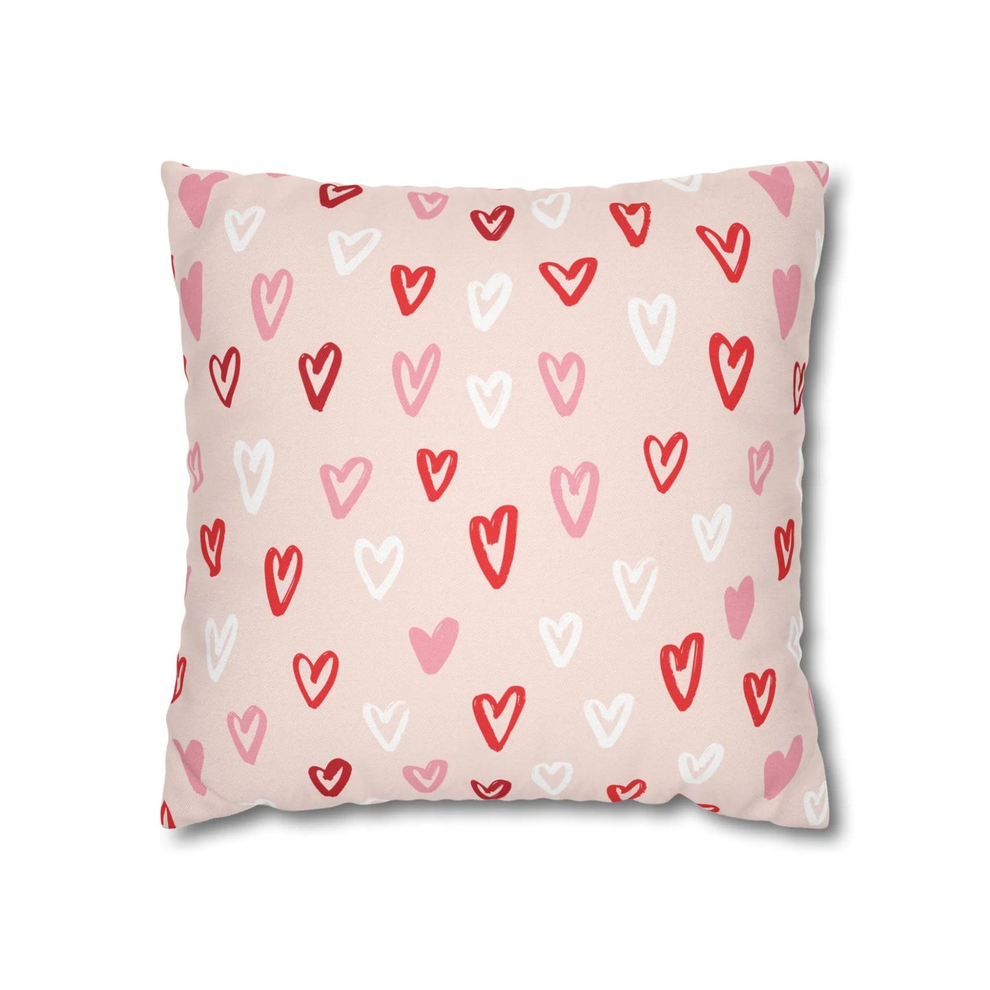 Cute hand-drawn hearts valentine pillow with colorful heart patterns on a pink background.