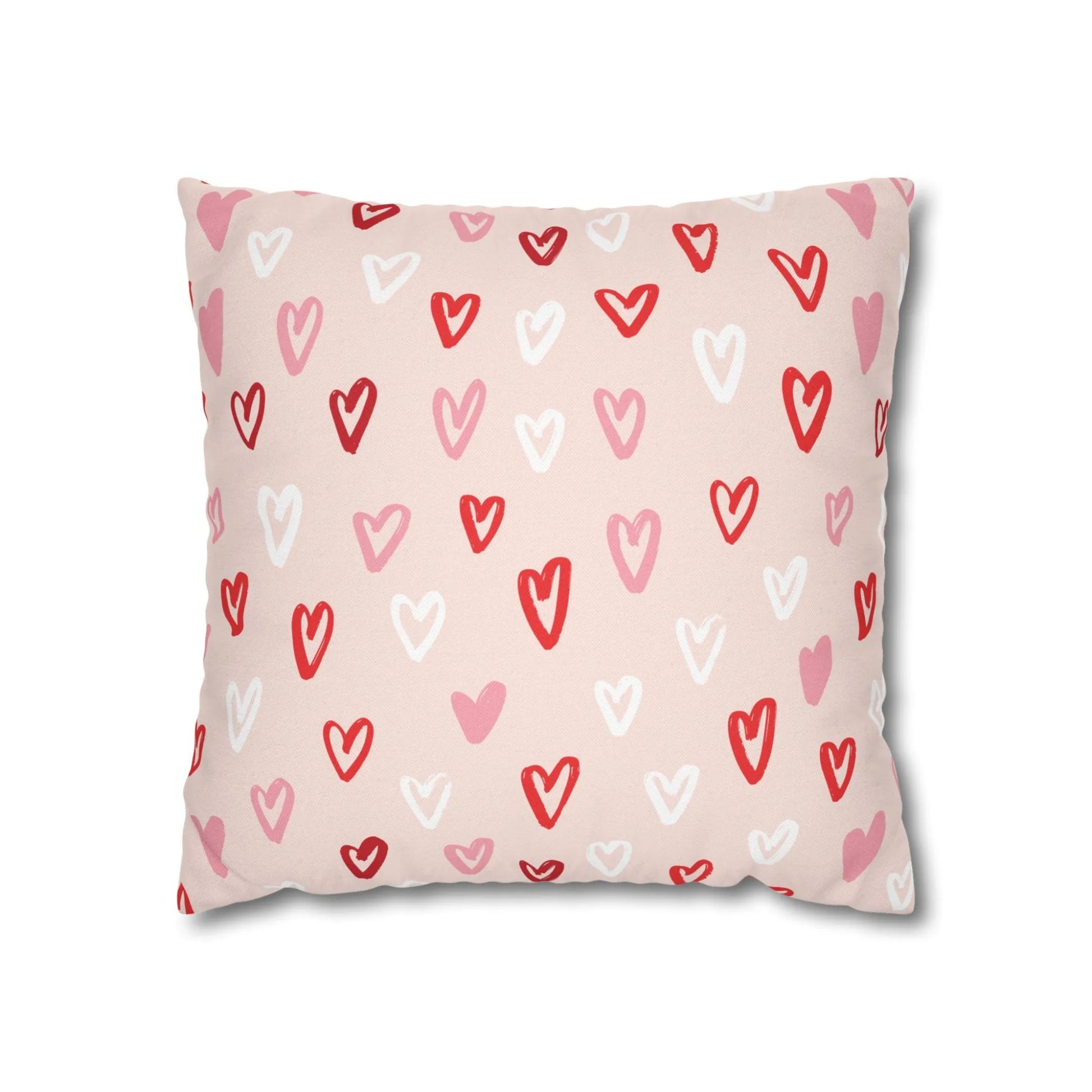 Cute hand-drawn hearts valentine pillow with colorful heart patterns on a pink background.