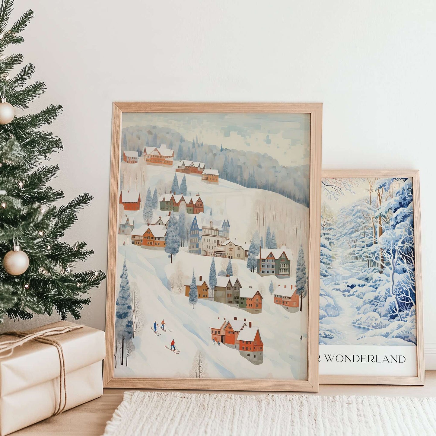 Cute Winter Village Art print displayed in a cozy winter home setting with Christmas trees and gift boxes.