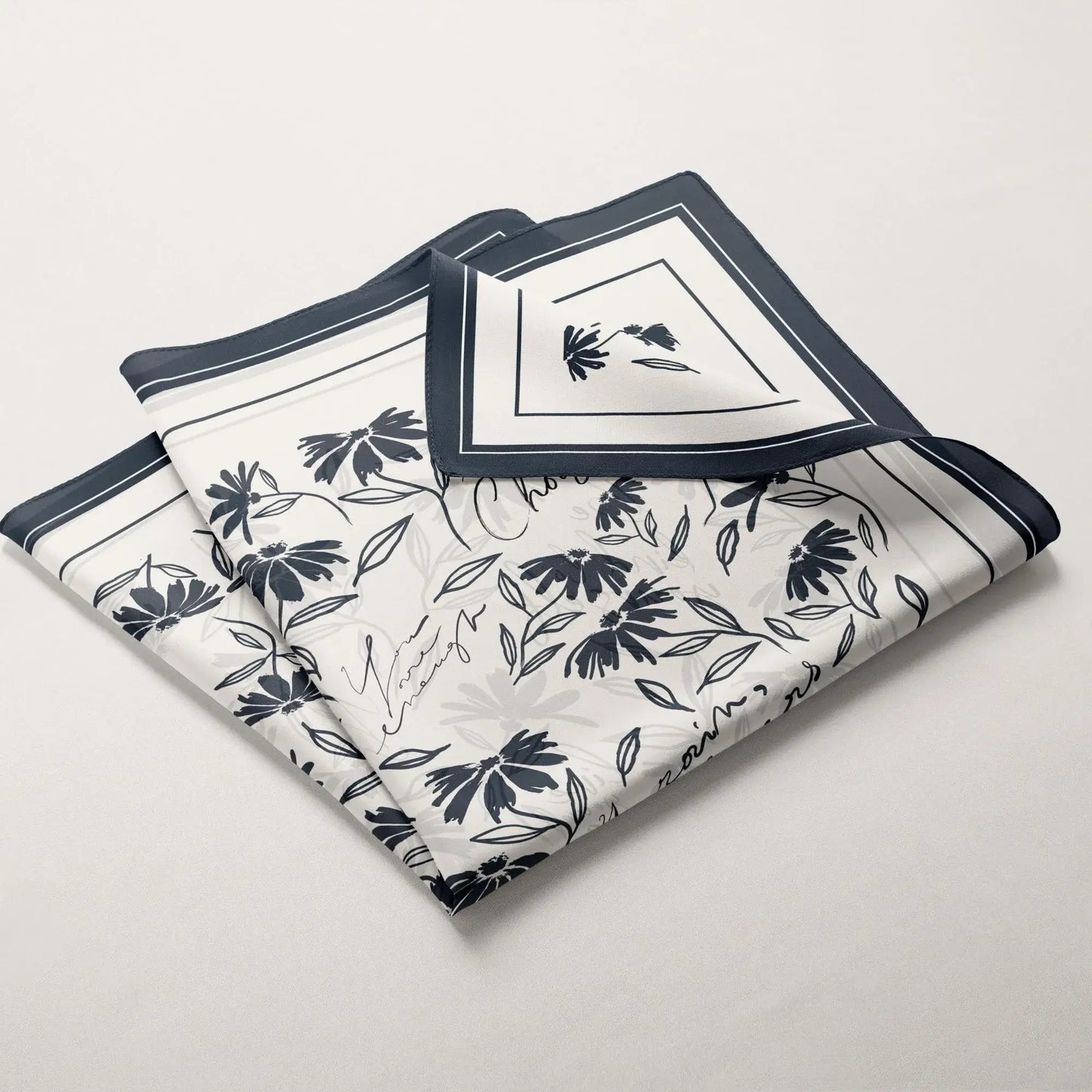 Daisy wildflowers silk scarf displayed layered and folded to show the botanical floral print and border