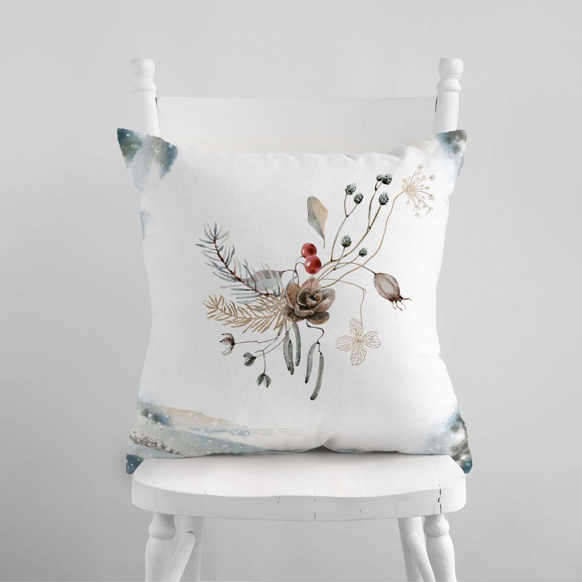 Winter Botanical Pillow Cover featuring watercolor winter plants on a white cushion, perfect for cozy home decor.