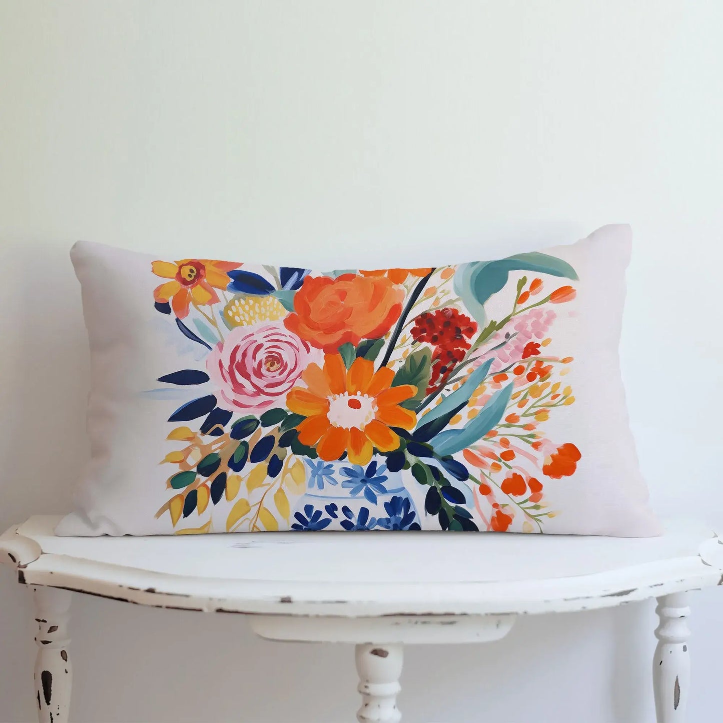 Fall floral pillow cover featuring autumn harvest blooms in vibrant colors on a decorative lumbar pillow