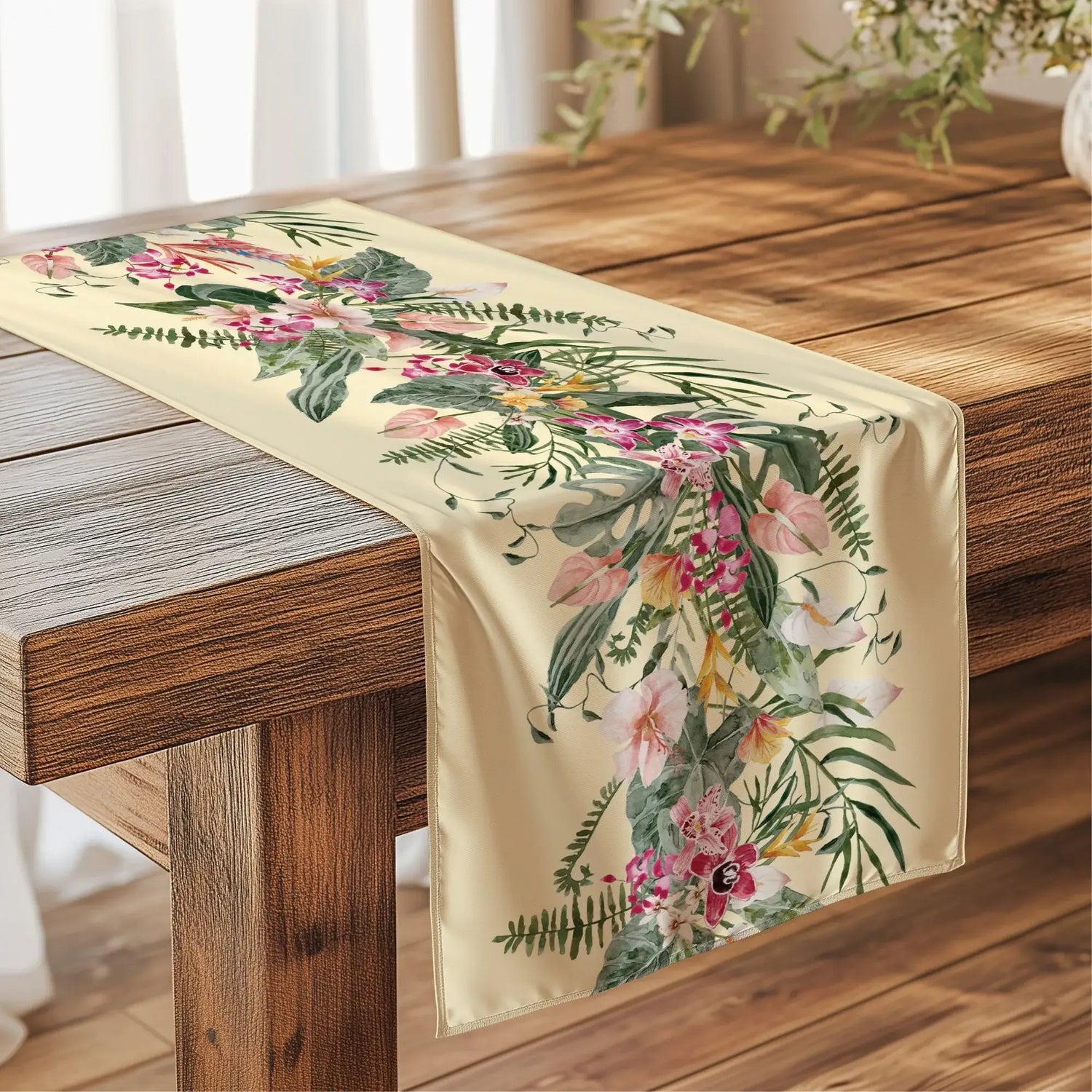 Floral Tropical TABLE RUNNER in light yellow with orchids and greenery on a wooden dining table.