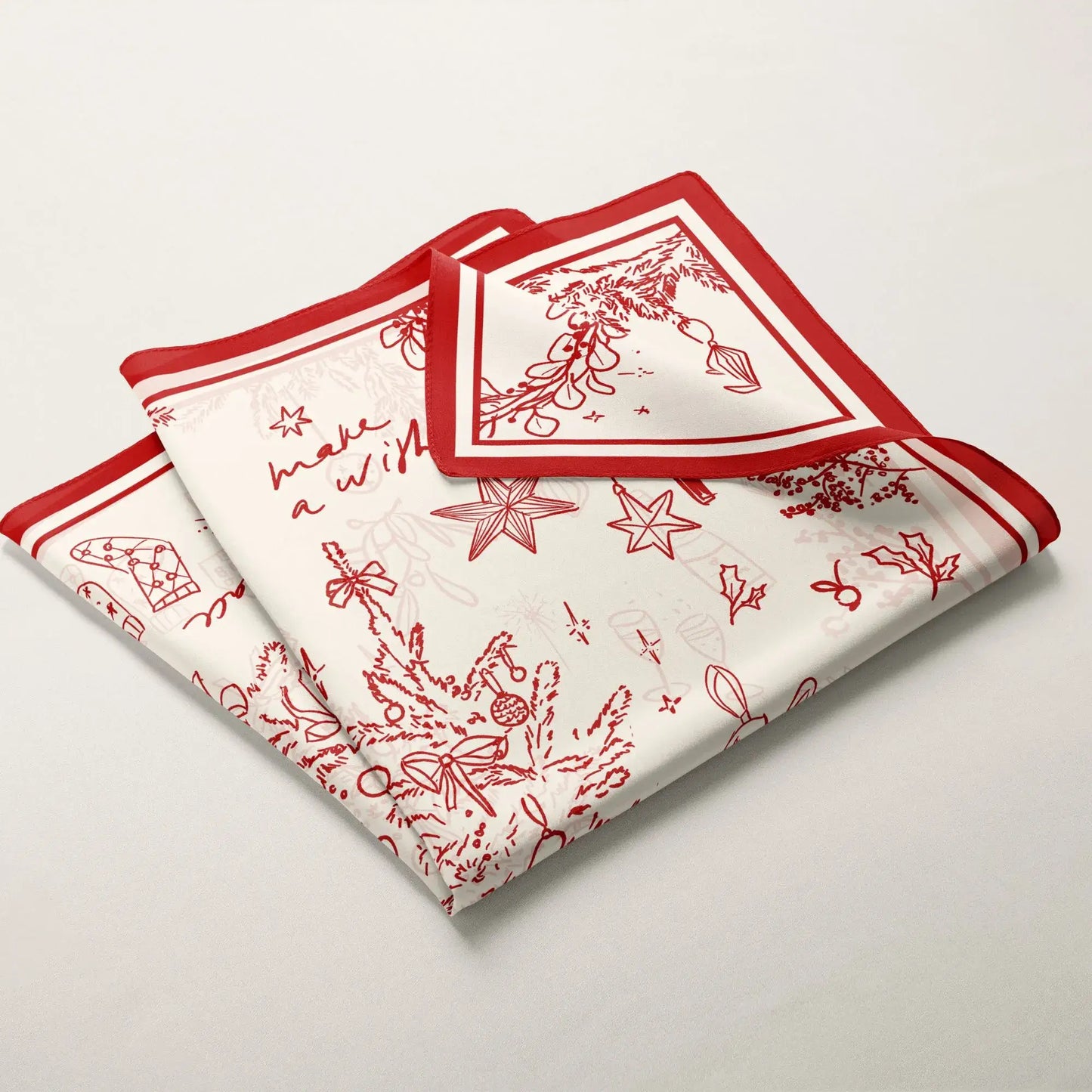 Red Christmas silk scarf folded with festive decorations. perfect gift for girls 