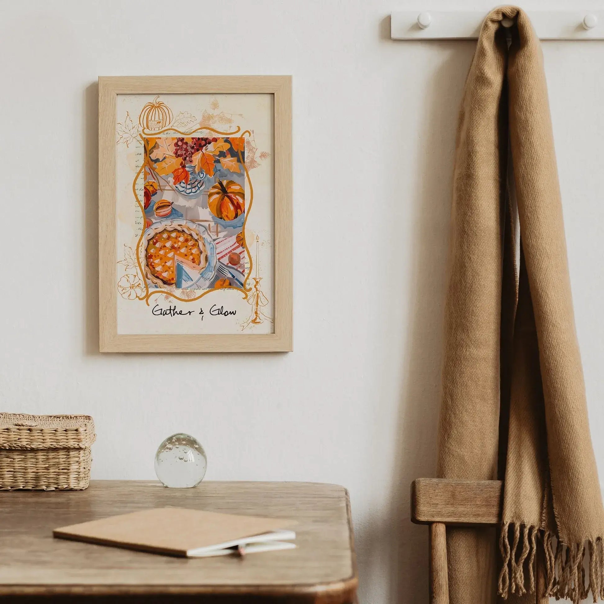 Thanksgiving autumnal wall art in wooden frame – cozy seasonal print styled with scarf, rustic desk, and woven basket