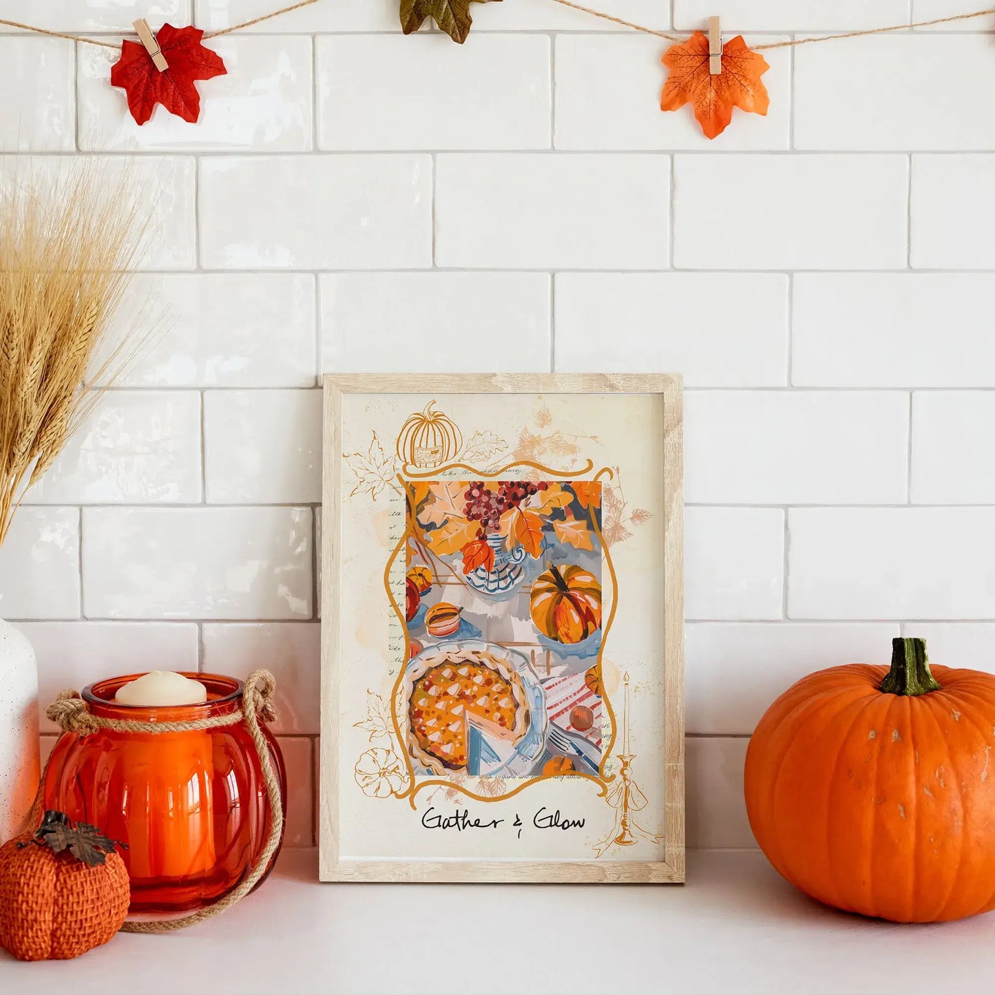 Gather & Glow Thanksgiving autumnal wall art framed on kitchen counter – seasonal fall decor with pumpkins, candle, and leaves