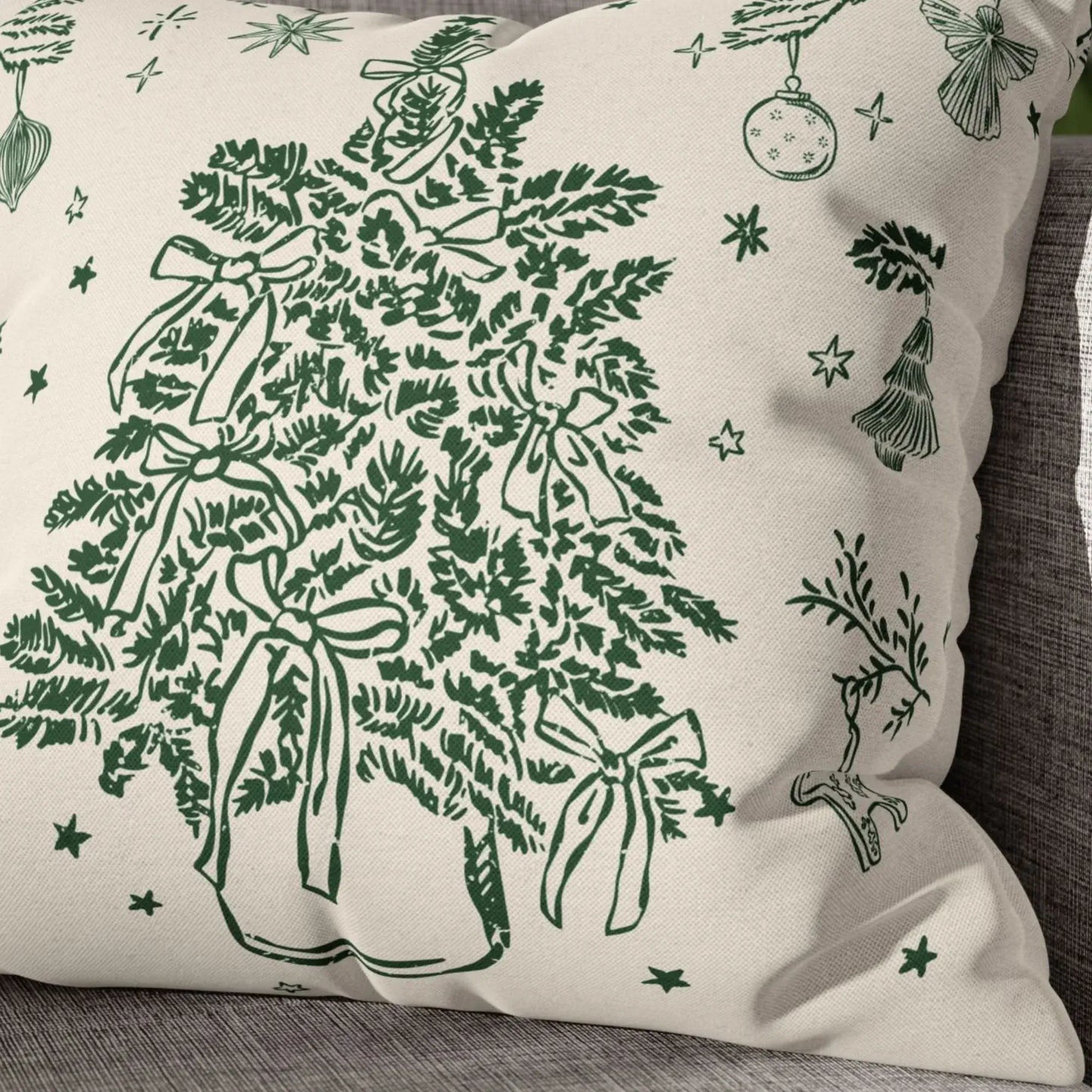 Close-up of vintage Christmas tree pillow cover with green botanical print and soft fabric texture