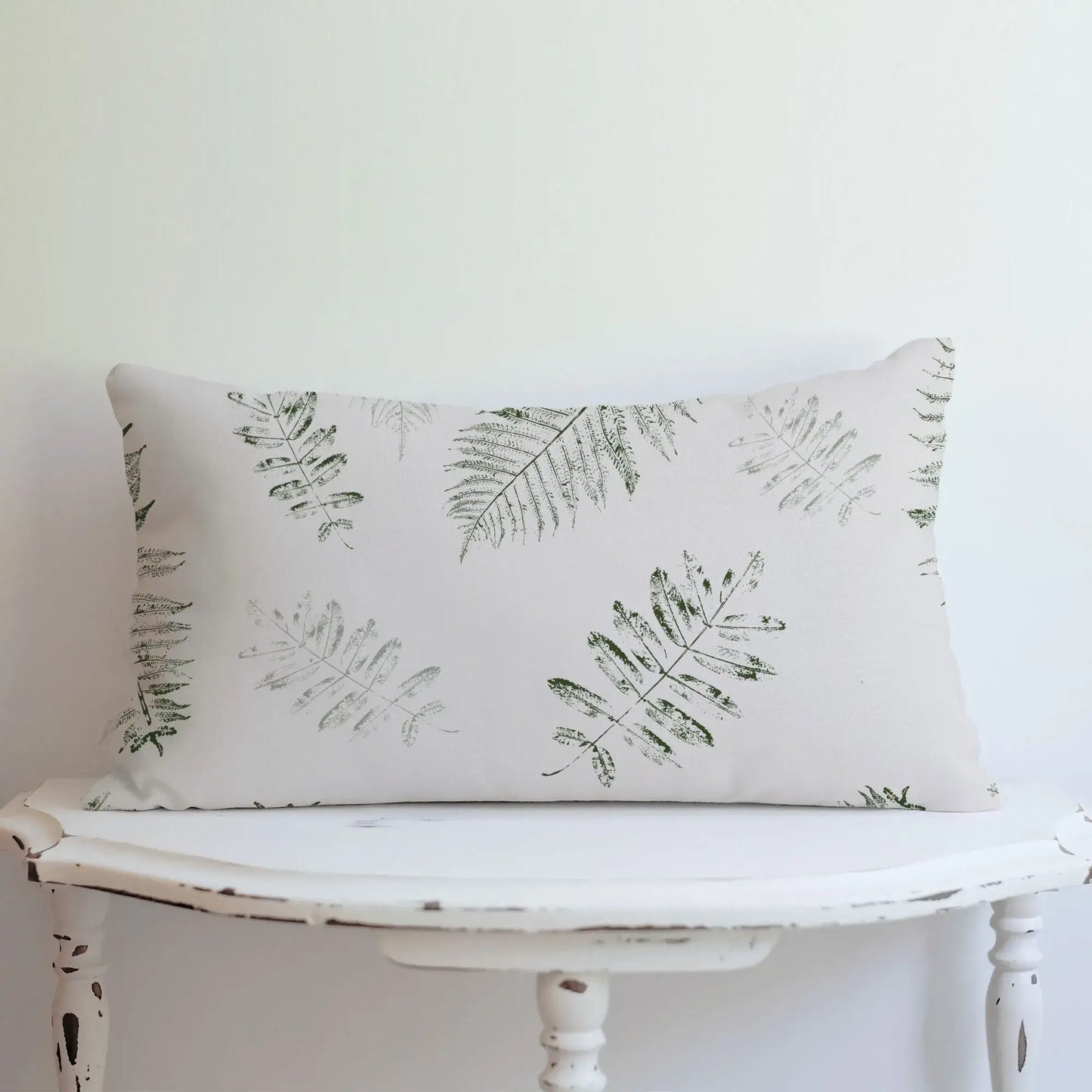 white table with Green Leaves lumbar PILLOW from Blue Water Songs 