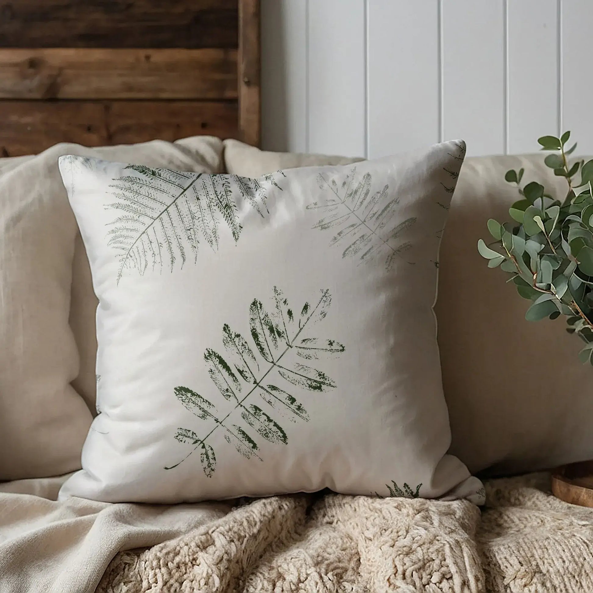 cream sofa with Green Leaves PILLOW from Blue Water Songs on it