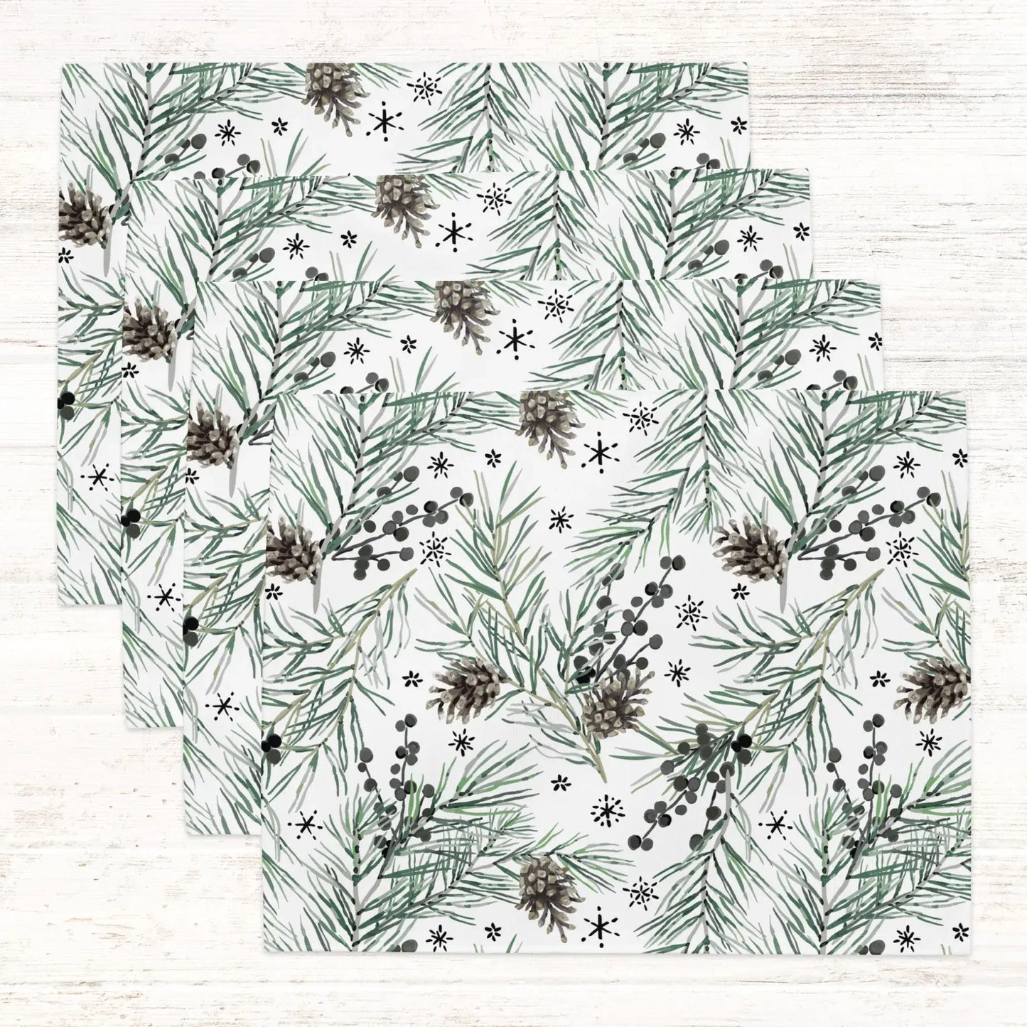 Green Pine and Berry Winter Botanical Placemats featuring lush pine and berry patterns on a white background.