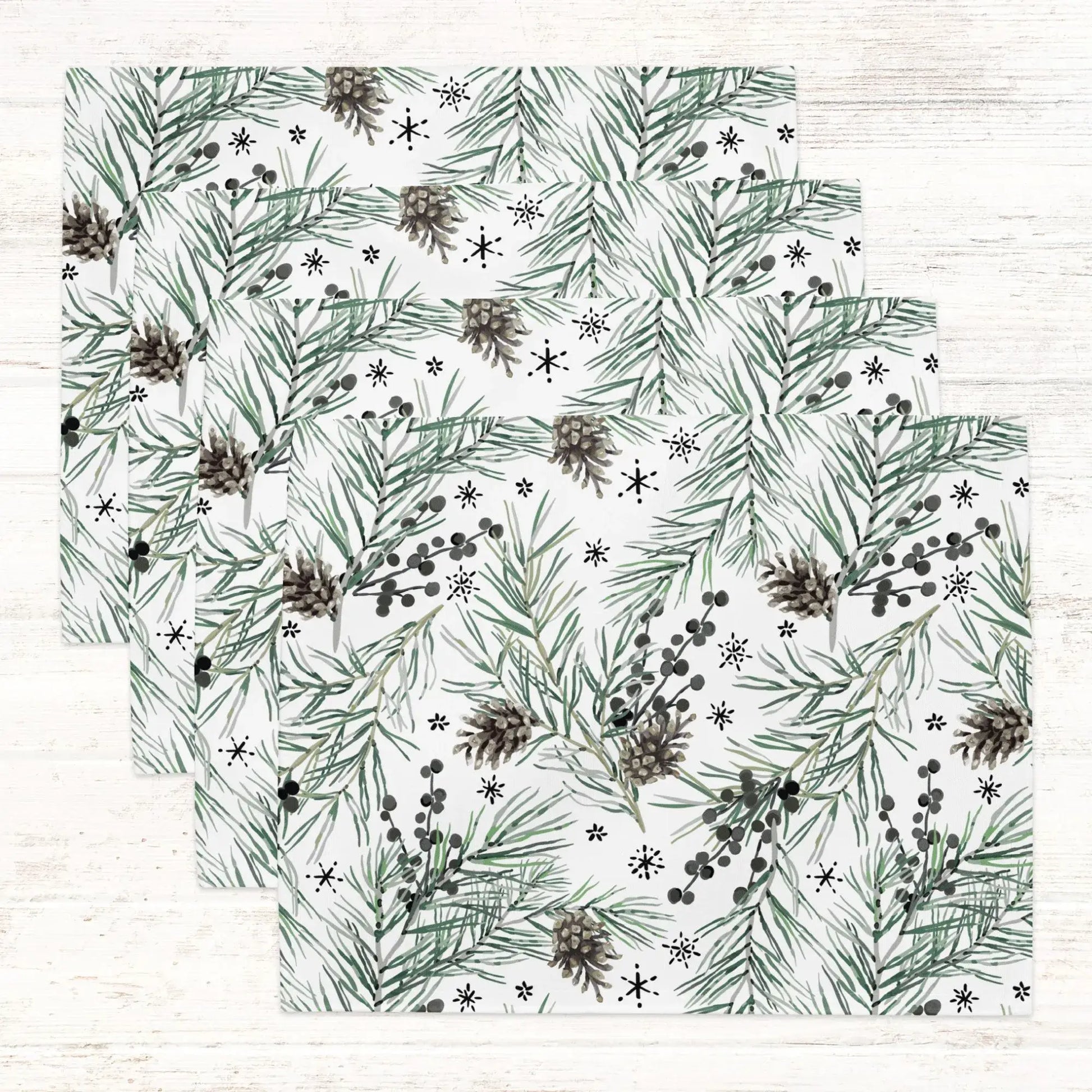 Green Pine and Berry Winter Botanical Placemats featuring lush pine and berry patterns on a white background.