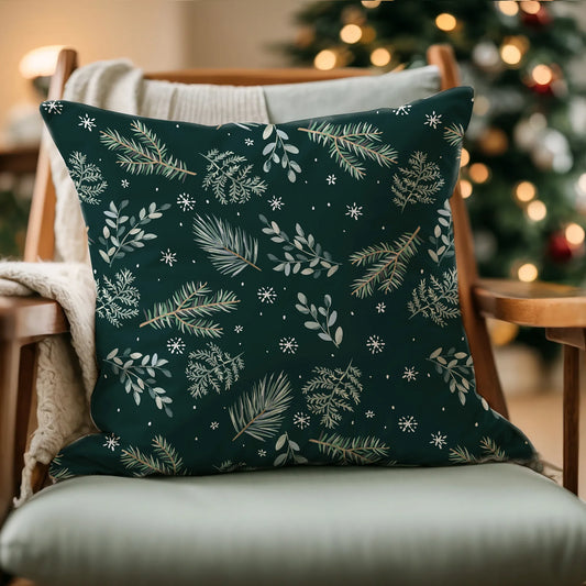 green pine winter pillow from Blue Water Songs on wood chair with christmas tree in the background