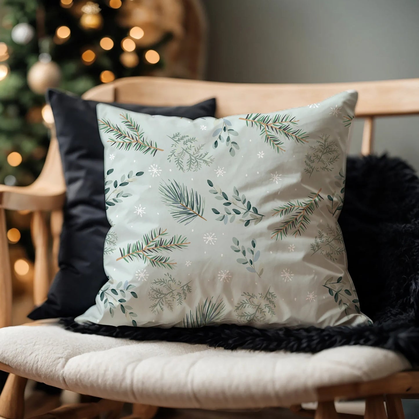 green pine winter pillow from Blue Water Songs on black fur blanket
