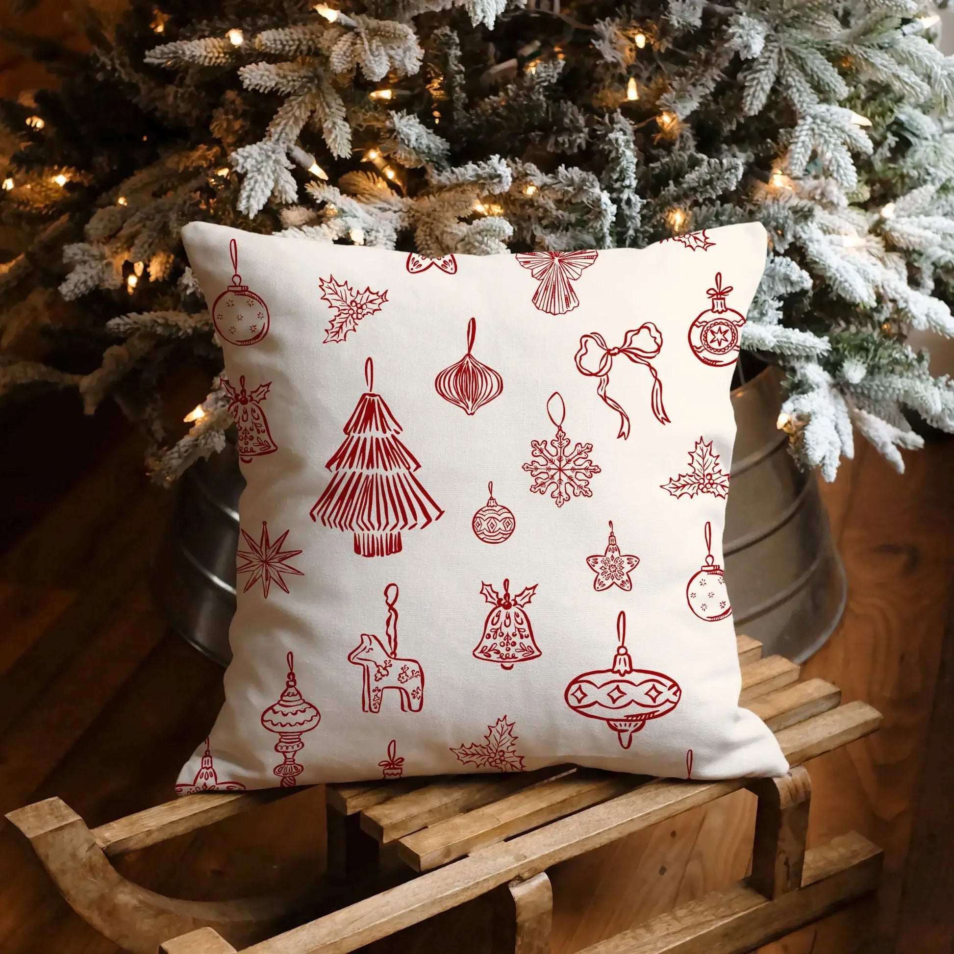 Hand-drawn red ornament Christmas pillow featuring festive designs in a Nordic style, perfect for holiday decor.