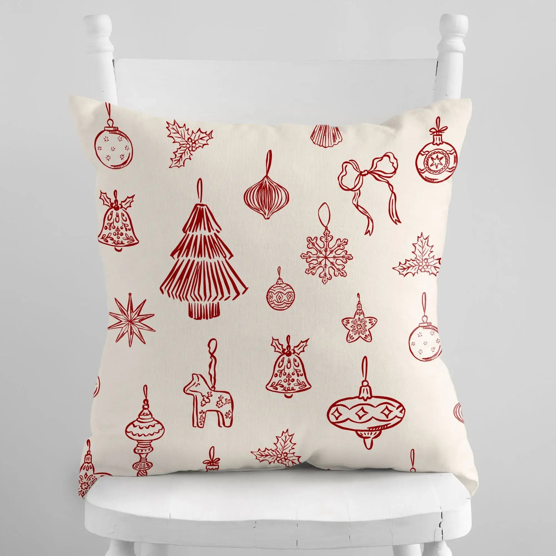Hand-Drawn Red Ornament Christmas Pillow featuring festive red line-art ornaments on a cream background.