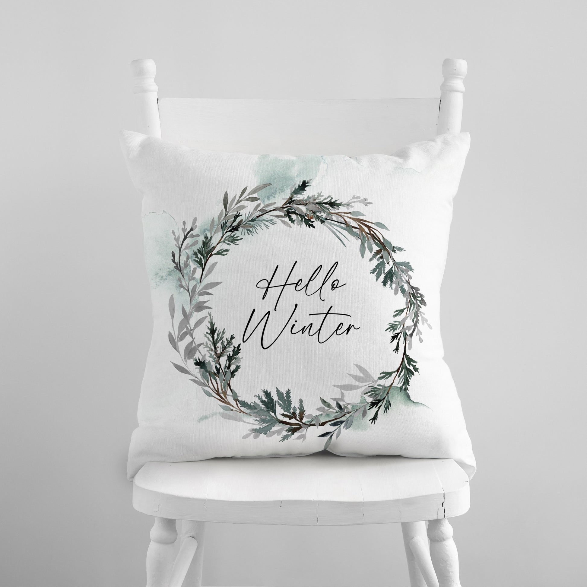 Hello Winter pillow with watercolor wreath – nature-inspired Christmas pillow for cozy seasonal decor