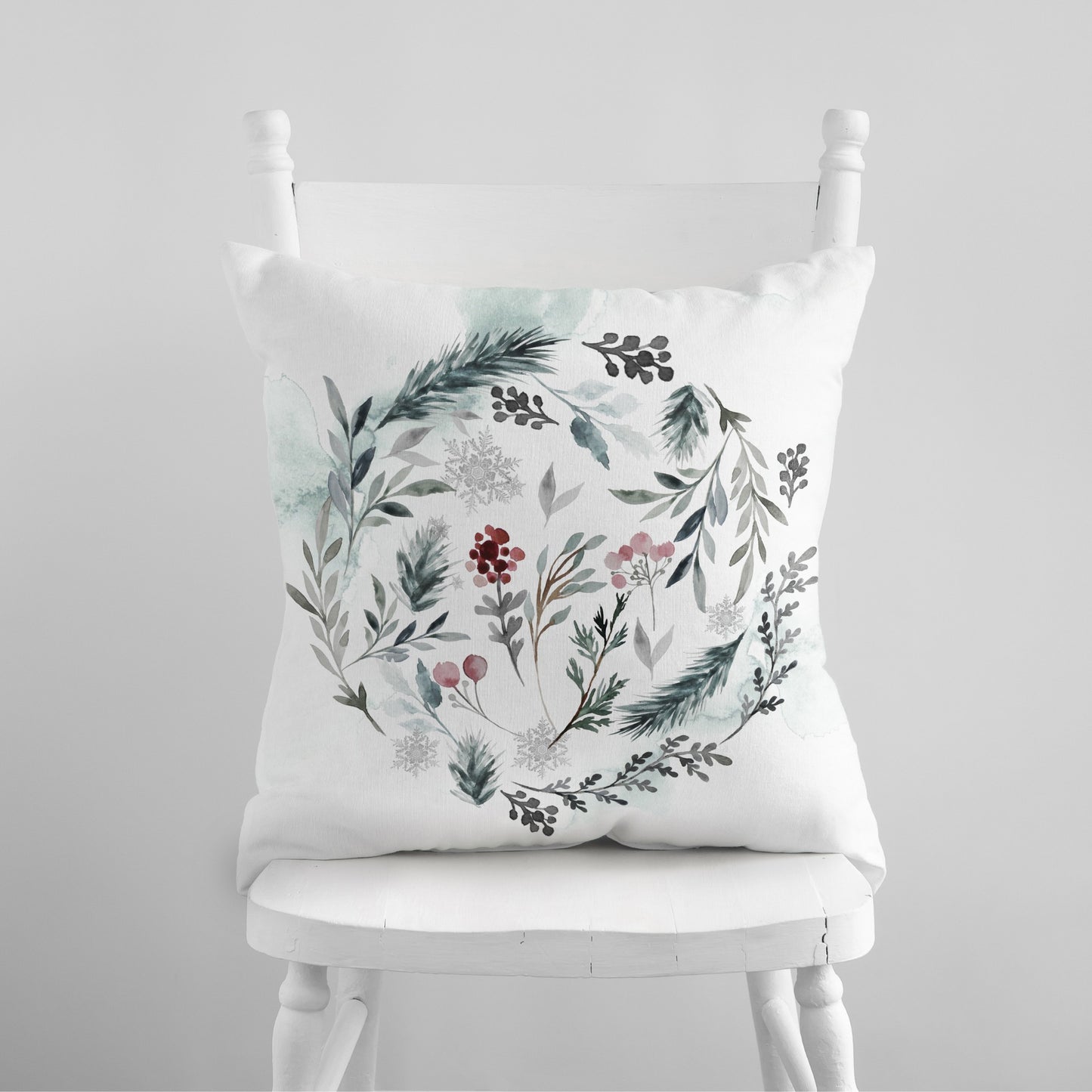 Hello Winter pillow with watercolor winter foliage on white chair – cozy seasonal home decor
