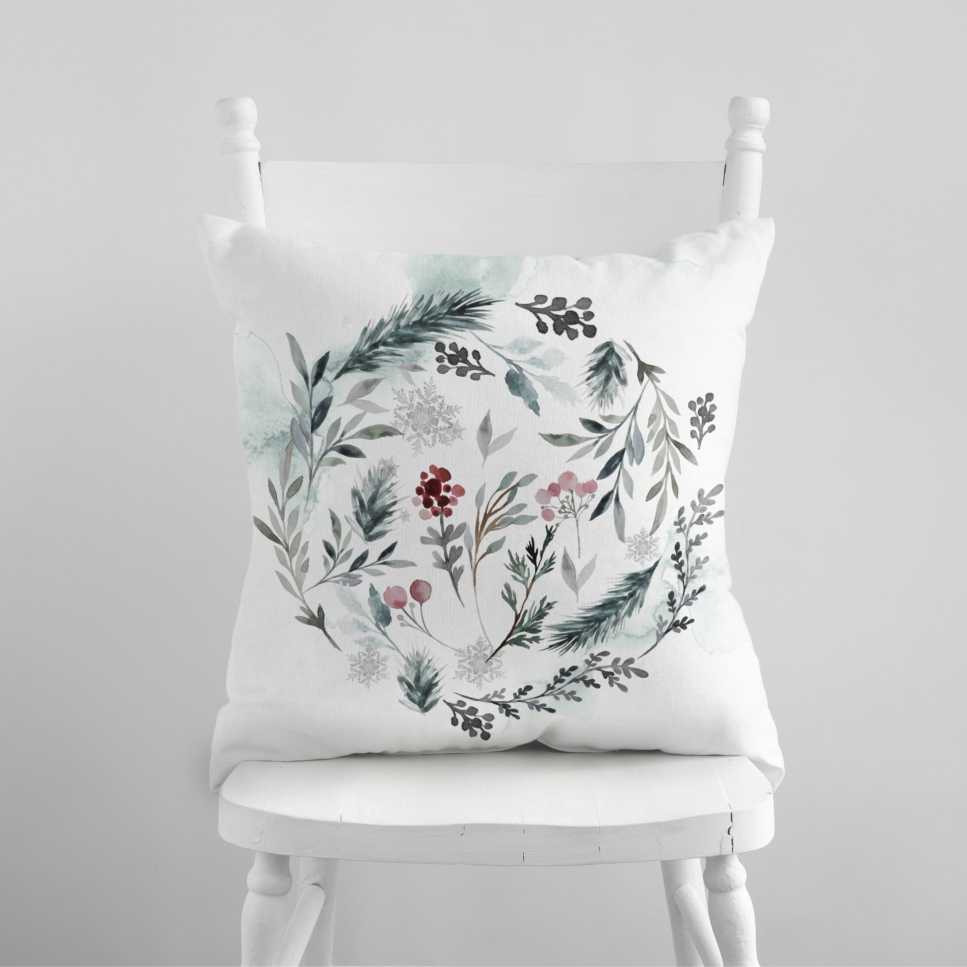 Hello Winter pillow with watercolor winter foliage on white chair – cozy seasonal home decor