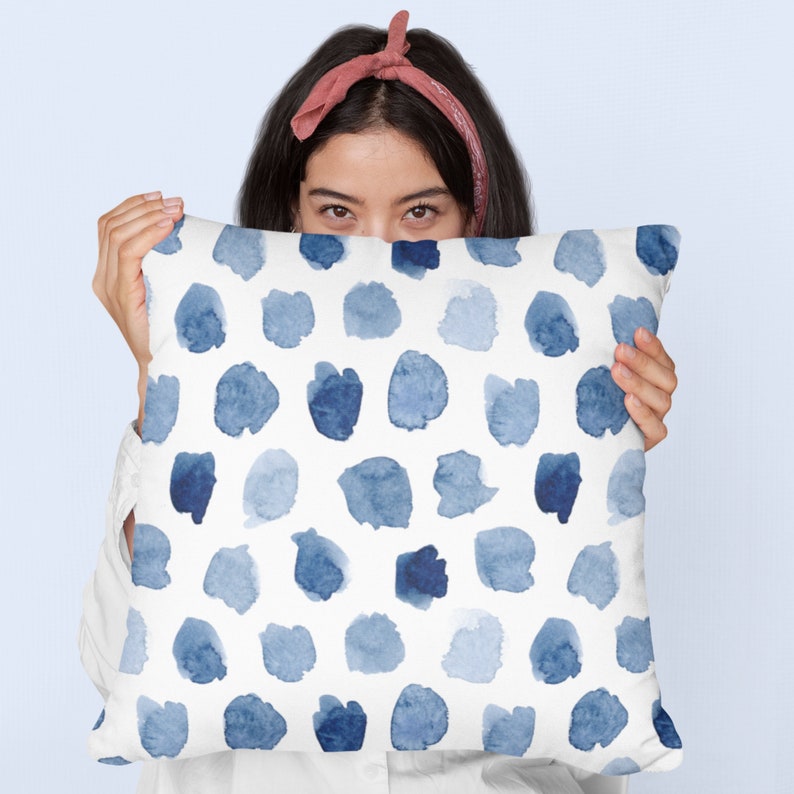 girl holding Watercolor Blue and White OUTDOOR PILLOW from Blue Water Songs