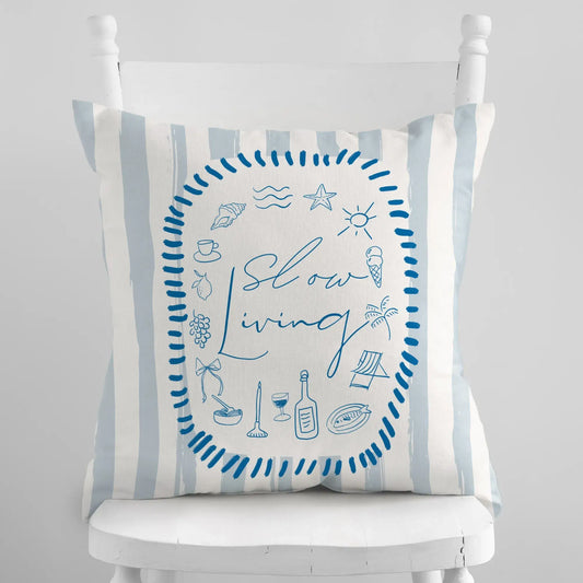 La Dolce Vita Pillow Cover featuring blue illustrations and striped design for slow living summer decor.