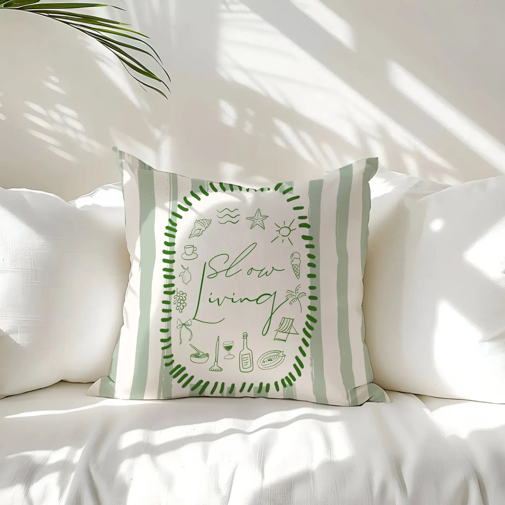 La Dolce Vita Pillow Cover featuring soft green illustrations and the phrase 'slow living' on striped background.